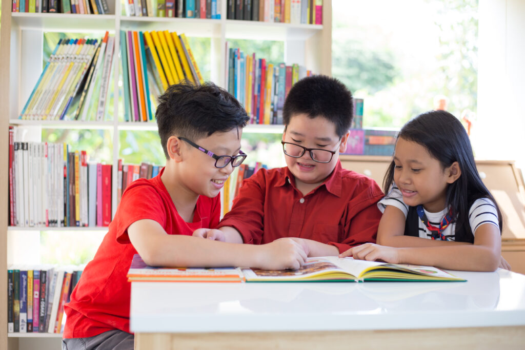 asian-young-girl-boys-reading-books-desk-happiness-feel-library-thier-school